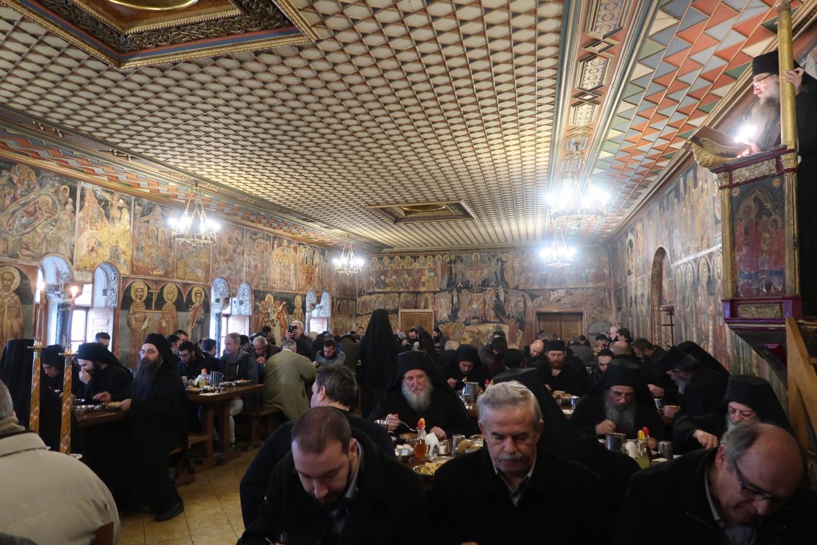 Harmonious mealtime with monks and guests at Xenophontos Monastery.