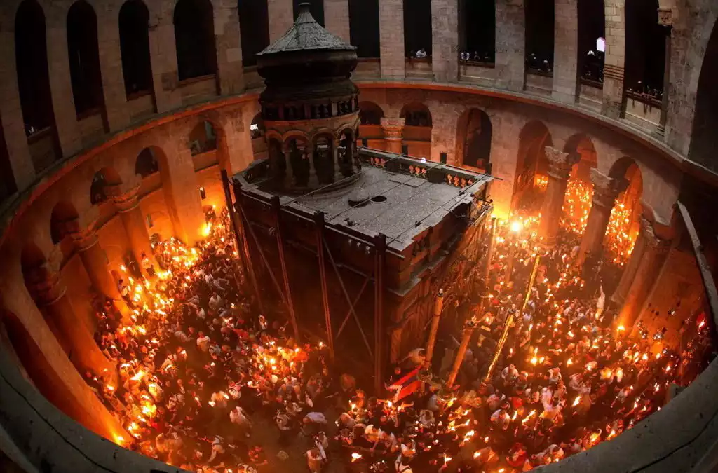 The Greek Orthodox Patriarch during the Holy Light sharing at the Sepulchre.