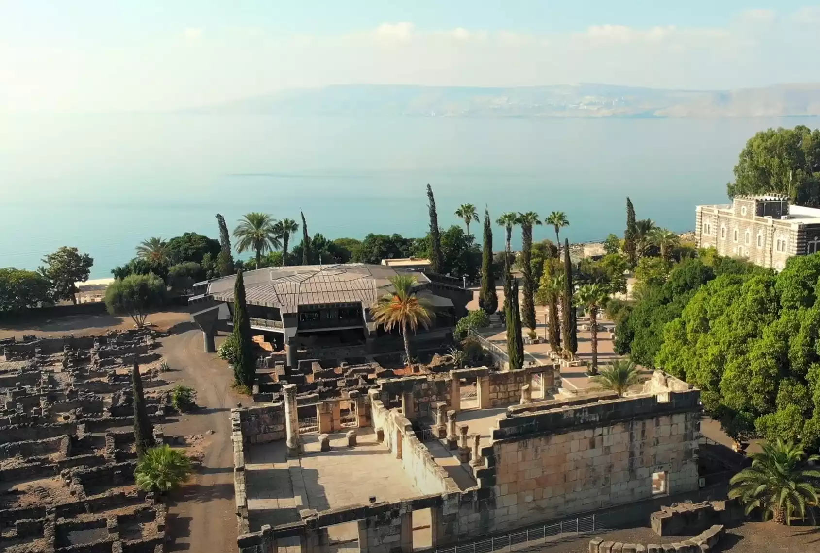 Sunset-glow-over-ancient-Capernaum-ruins,-stone-relics-visible