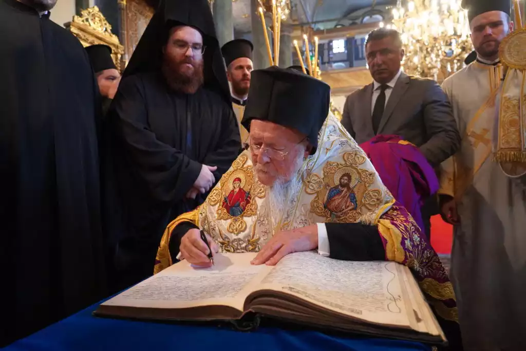 Ecumenical-Patriarch-Bartholomew-signing-Book-Indiction.