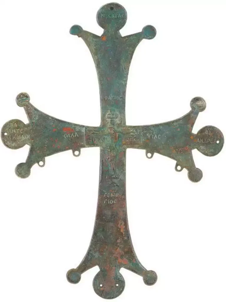 A superb example of baptism gifts. A copy of an 11th century Byzantine metalwork, this cross vividly combines Christian imagery and Greek lettering in harmonious style.