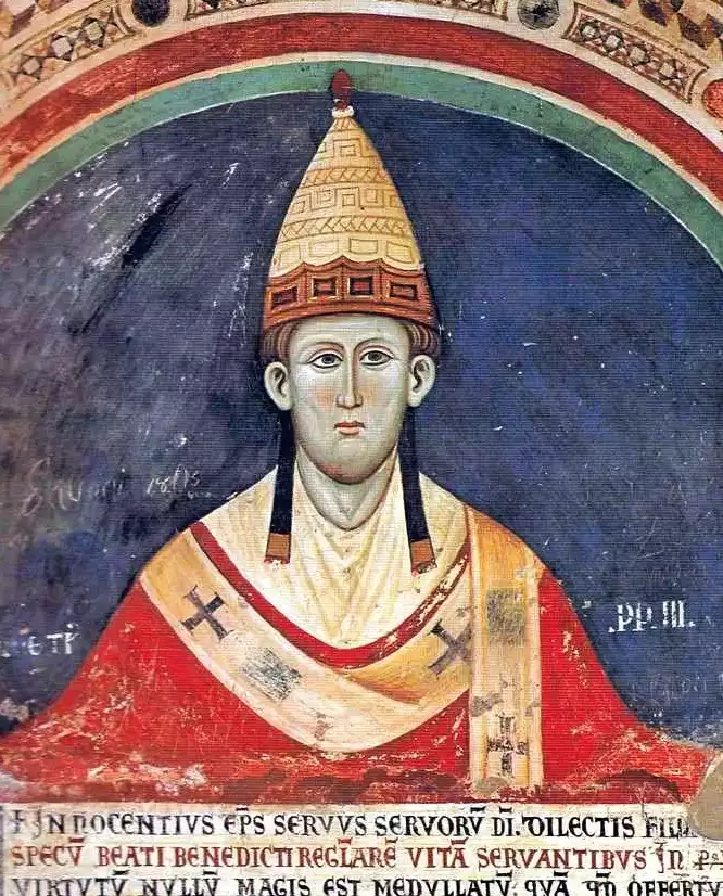 Mural of bearded Medieval Pope Innocent the Third bestowing blessings inside Italian abbey
