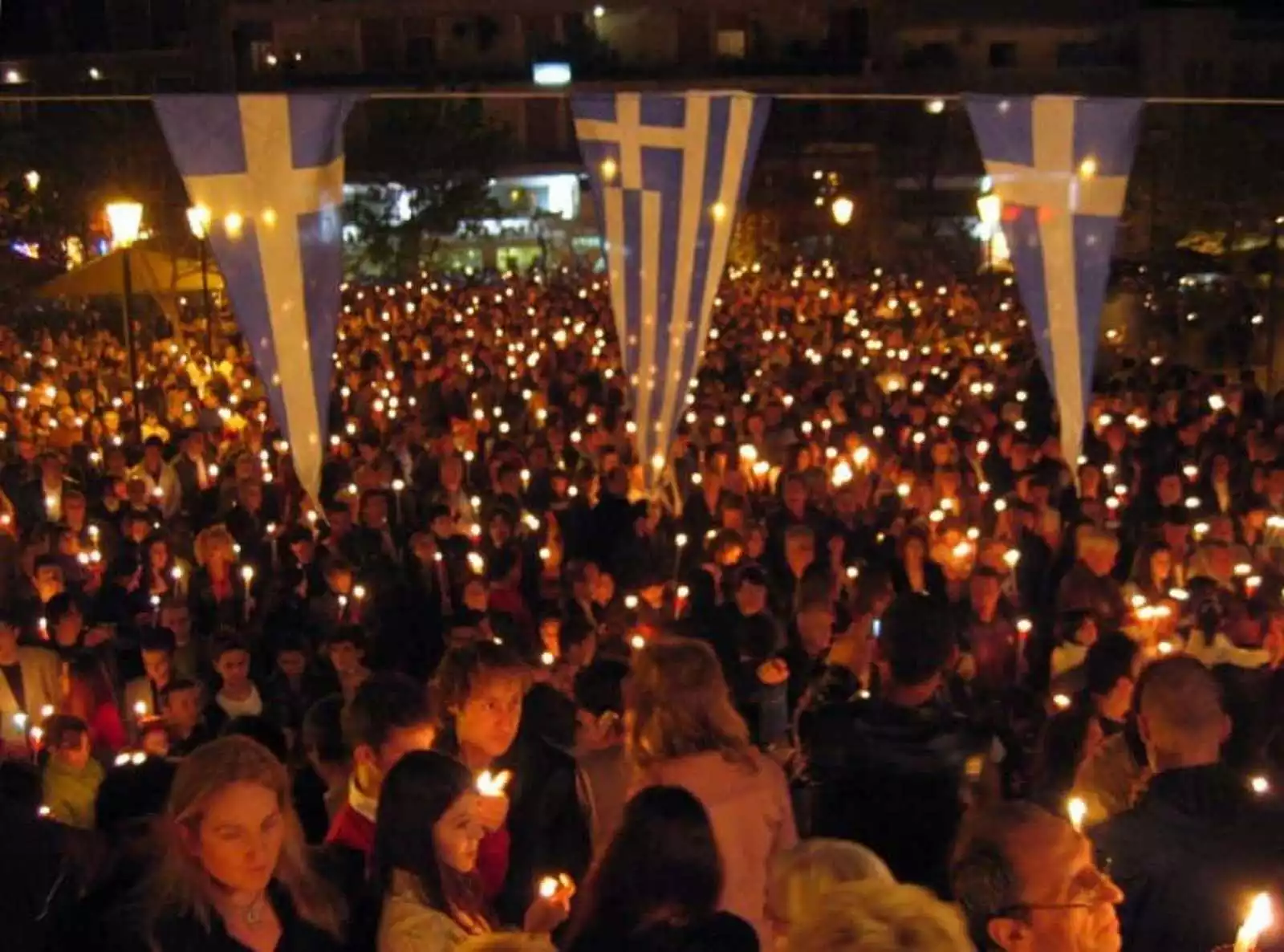Greeks commemorate Orthodox Easter publicly - Cities bright with candles, songs on Holy Saturday.